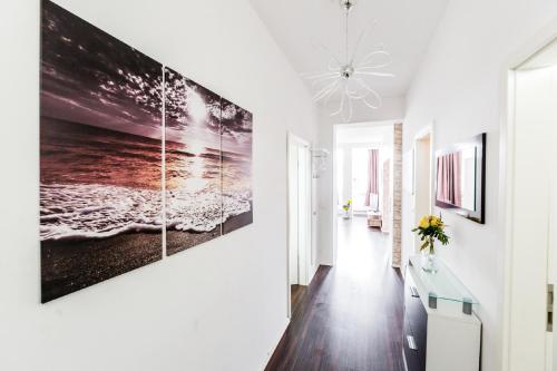 a hallway with a large painting on the wall at Work & stay Langenfeld in Langenfeld