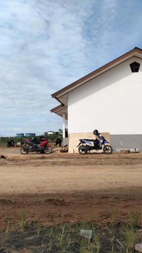 two motorcycles parked in front of a building at Kotabaru in Gununganjar