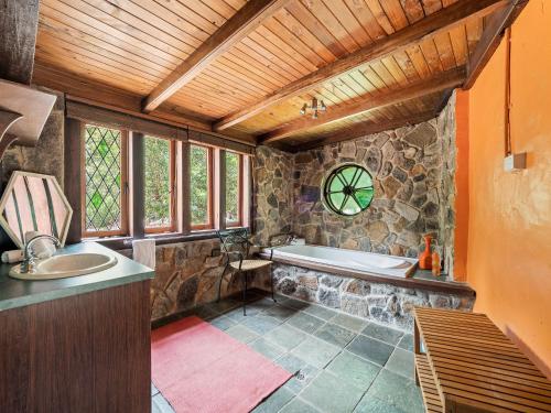 a large bathroom with a tub and a sink at Kookaburra Retreat - Dog Friendly - Forest View in Gnarabup