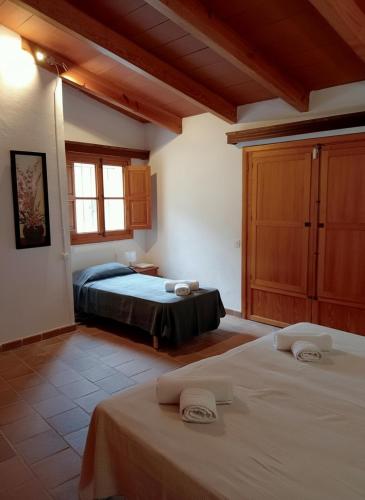 a bedroom with two beds in a room at Cozy Chalet with Sea Views & Private Pool in Valldemossa