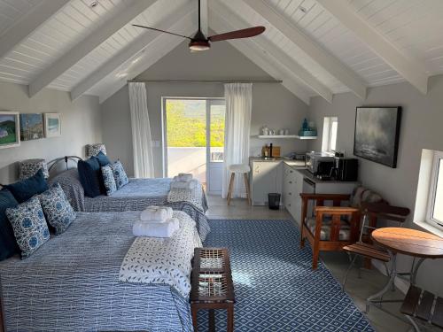 a living room with a bed and a couch at McGregor Hideaways in McGregor