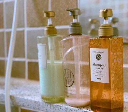 three bottles of soap sitting on a counter at Yuzawa Hotel New Fukudaya-ski in ski out in Minami Uonuma