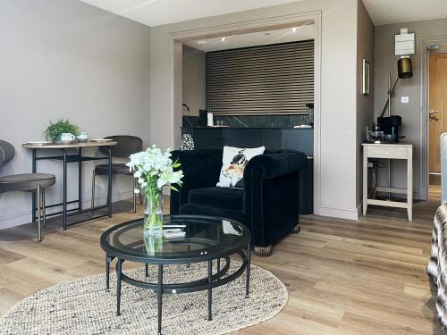 a living room with a couch and a table at The Foxes Hole - Uk49085 in Winewall