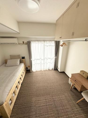 Llit o llits en una habitació de Hanazono405