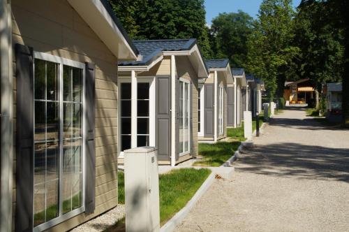 a row of houses on the side of a street at Chalet am Pilsensee in Seefeld