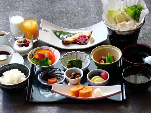 a tray of food with different bowls of food at Resort Hotel RAKI House Nasu in Nasu