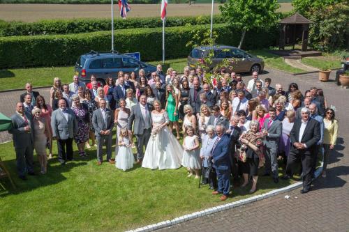 a group of people posing for a picture at a wedding at Best Western Gables Hotel in Falfield