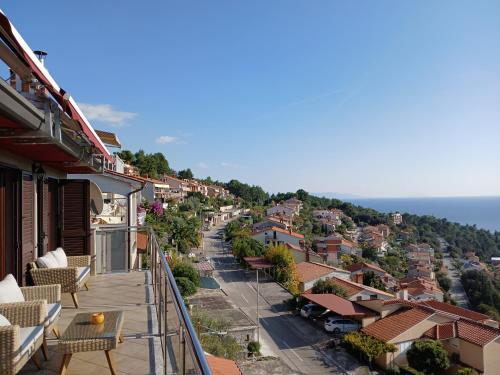 a view of a town from the balcony of a house at RED House Rabac in Rabac