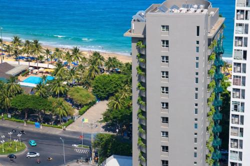 an aerial view of a building and the beach at MissBamboo Hotel Nha Trang in Nha Trang