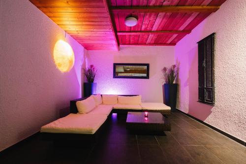 a living room with a couch and a table at hotel zentlinde in Mossautal