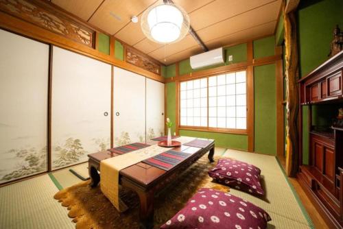 3-story building airport bus direct access JR Namba Station Kintetsu subway Shinsaibashi Dotonbori within walking distance