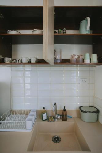 a kitchen with a sink and a counter top at Villa Serena in Dauis