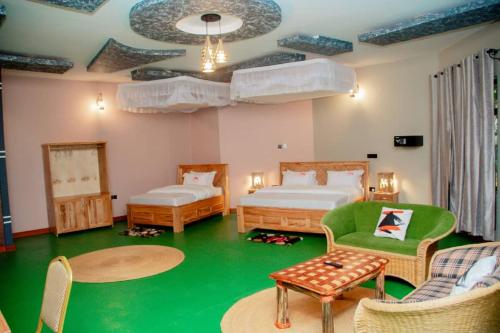 מיטה או מיטות בחדר ב-Asmorein Hotel