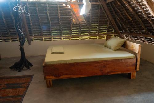 a bed in the middle of a room at Rasal homes in Gazi