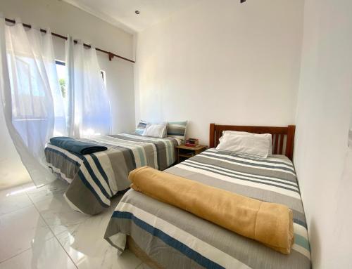 Llit o llits en una habitació de ClearBlue Villa