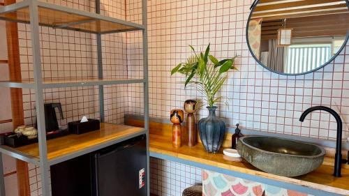 a bathroom with a sink and a mirror at WHITE SAND ARK RESORT in Koh Rong Island