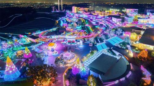 an amusement park lit up at night with christmas lights at ラフィーネハイツ201 in Fuchu