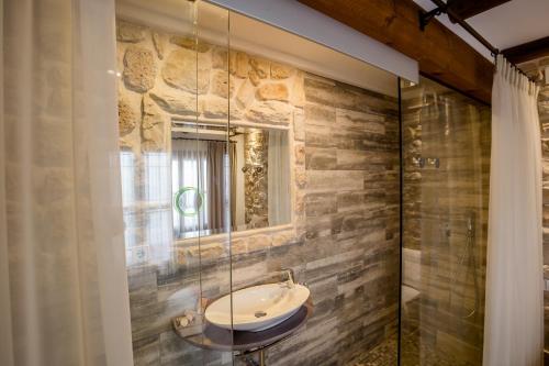 a bathroom with a sink and a mirror at Hotel Abaco Altea in Altea