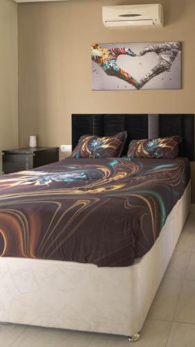 a bedroom with a bed with a wooden frame at Villa Veranos, Rojales, Benijofar, Alicante, Valencia in Rojales