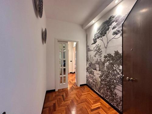a hallway with a large painting on the wall at Appartamento Rosa in Gualdo Tadino