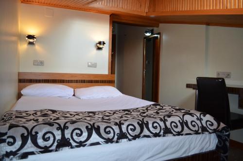 Postel nebo postele na pokoji v ubytování Atlas Otel