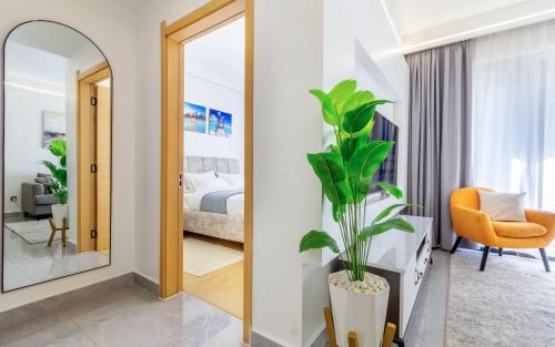 a bedroom with a bed and a mirror at Kalm apartment- Luxury Living with a Gym, Heated Pool & Stunning Views in Nairobi