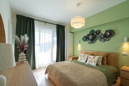 a bedroom with a bed and a large window at GreenVista 20 minutes by Therme & Airport in Voluntari
