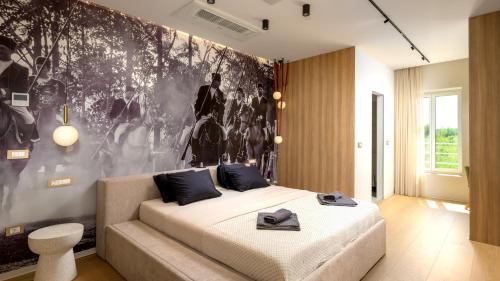 a bedroom with a bed and a black and white wall at Villa Corsa by Villas Guide in Barban