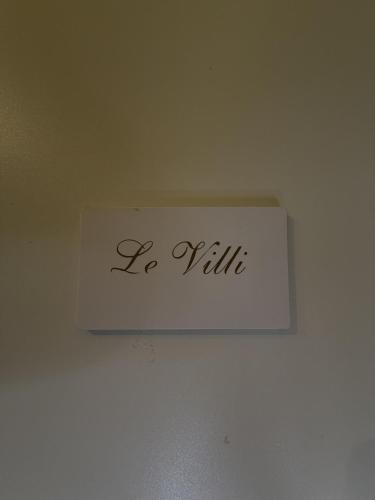a white sign on a ceiling with the word vaille at Guest House Santa Giustina Lucca Centro Storico in Lucca