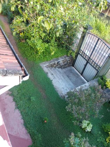 an aerial view of a garden with grass and a bench at Dune Villa in Hikkaduwa