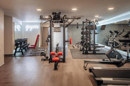 a gym with several treadmills and exercise bikes at Two Bedroom Warm and Cozy Retreat in Exeter in Exeter