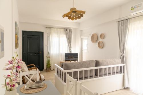a baby room with a crib and a couch at The litlle mermaid in Amaliapoli
