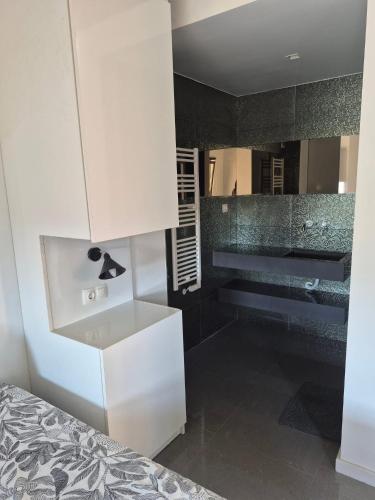 a bathroom with a white cabinet and a sink at 123 Muda Life in Sesimbra