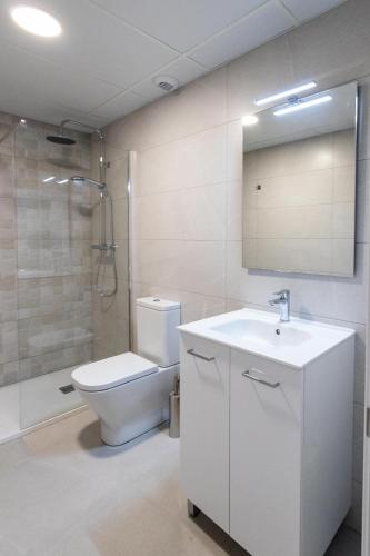 a bathroom with a toilet and a sink and a shower at Iberflat Apartamentos Alfabega in Paterna