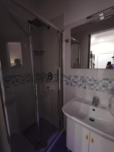 a bathroom with a shower and a sink and mirror at Ai Vecchi mulini in Gragnano