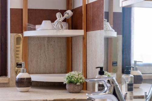 a bathroom with a sink and a mirror and a sink at Villa Fenix Seriate in Seriate