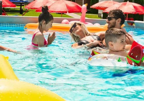 a group of people in a swimming pool at Holiday Park Zator in Zator