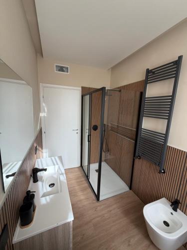 a bathroom with a sink and a toilet at Milan house 2 in Samarate