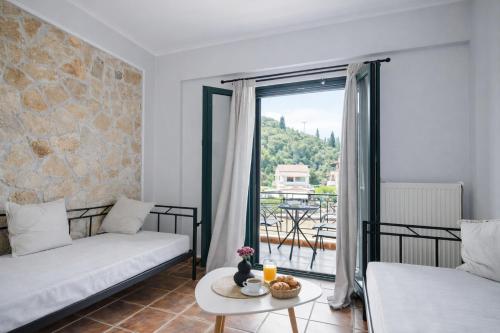a living room with a couch and a table at villa Fotini 2 (new) in Syvota