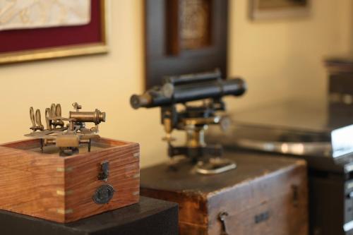an old fashioned sewing machine on a wooden box at World Traveler Nest in Kotor
