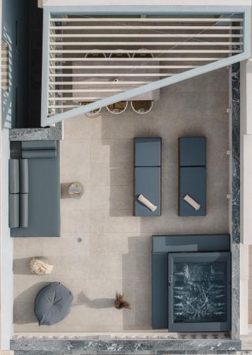 a model of a house with a tv at Luxury Suites by Lato in Agios Nikolaos