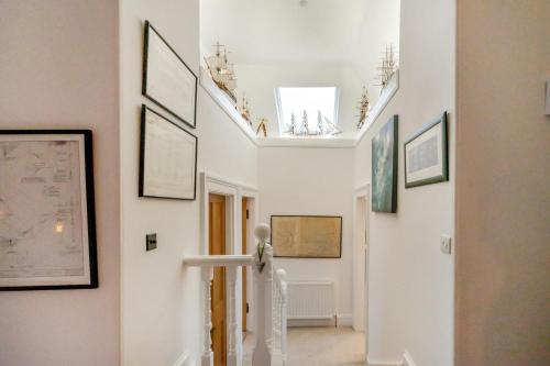 a hallway with pictures on the walls of a room at 4 Bed in Pittenweem oc-t35090 in Pittenweem