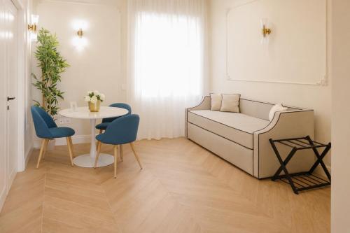 a living room with a couch and a table at SOFIA Suites & Rooms in Pompei