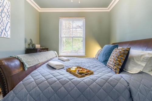 a large bed with a tray of fruit on it at 5 Bed in Llangollen oc-l34205 in Llangollen