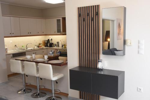 a kitchen with a table and chairs in a kitchen at Sparta Central Apartment with Free Parking in Sparta