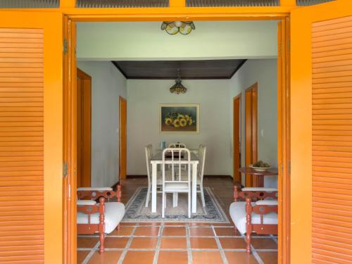 a dining room with a table and chairs at Casarão in Marechal Floriano