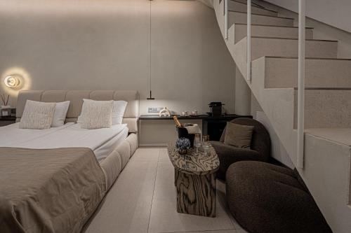 a bedroom with a bed and a stair case at SPA apartamentai Palanga in Palanga