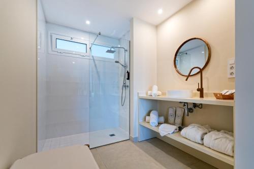 a bathroom with a glass shower and a sink at Amadores View - Adults only in Mogán