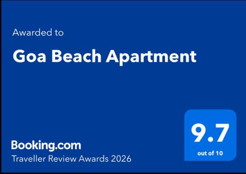 a blue sign that says goa beach appointment at Goa Beach Apartment in Colva