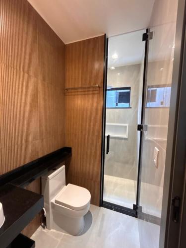 a bathroom with a toilet and a shower at LD Smart Residence in Castanhal